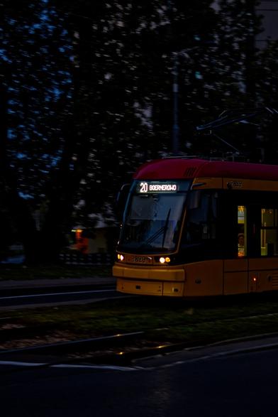 PESA 134N number 3829 in yellow and red colours of Tramwaje Warszawskie, on line 20 direction Boernerowo. Photography made at sunset, in motion.