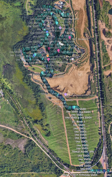 A screenshot of a map of the MN Renaissance Festival grounds and surrounding area. The ground are swarmed by Google Earth balloon place markers denoting bluetooth device presence. The map is awash in the balloons.