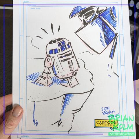 R2D2 fan art where he meets Optimus Prime from Transformers. Done at the Transformers One themed sketch-a-thon at the Cartoon Art Museum.