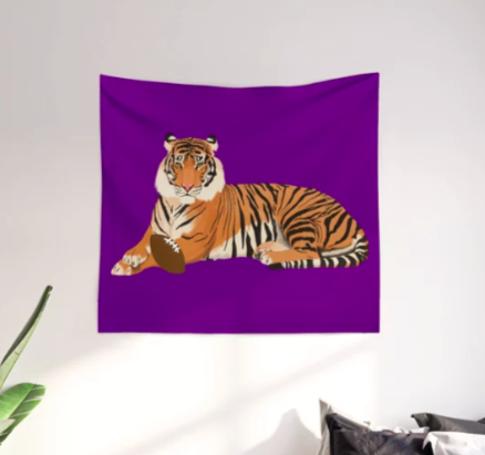 Our purple tiger mascot is playing football, as shown on a tapestry.