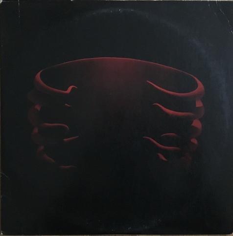 Picture of an album cover with a red ribcage on a black background