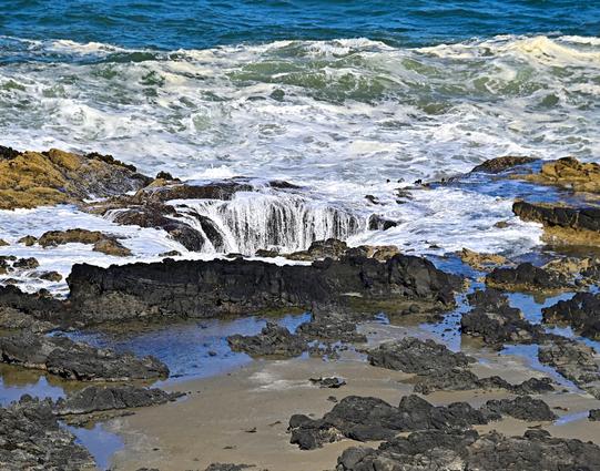 Thor’s Well is a bowl-shaped hole carved into the basalt shoreline of Cape Perpetua in Oregon. The seemingly bottomless well perpetually fills and drains throughout the day. Researchers now believe that Thor’s Well began as a large sea cave. The sea cave slowly formed over thousands of years as waves crashed into the volcanic rock that made up the shoreline. It eventually collapsed, leaving a bowl-shaped hole just feet from shore. During high tide, water shoots out the top like a geyser, reaching heights of up to 40 feet.