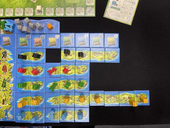 Vikings game board with six rows of tiles, many of which have meeples on them