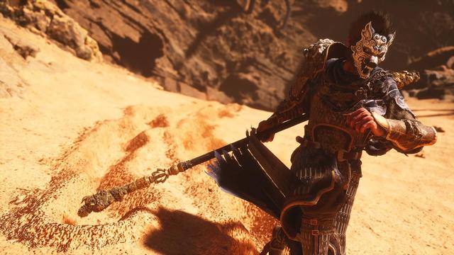 The same picture, only zoomed out further. In his hand, the character holds a large, ornately carved staff, which leaves a trail deep in the sand. The background shows rocky cliffs under a dramatic, cloudy sky, giving the scene a dark and epic atmosphere.