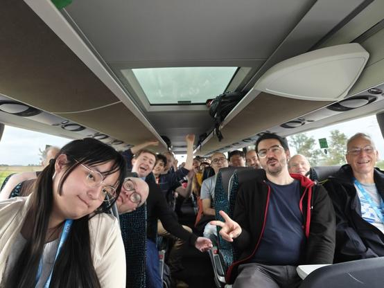 Group photo of attendees in the bus going to visit Rothenburg ob der Tauber