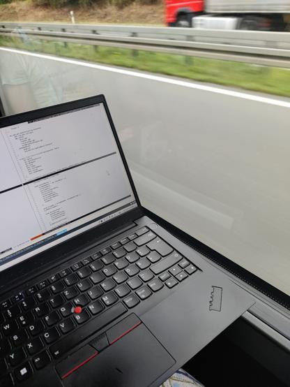 Picture of a laptop with the highway in the background