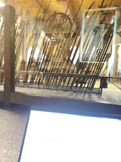 Picture of my laptop open with a lot of weird weapons in the background