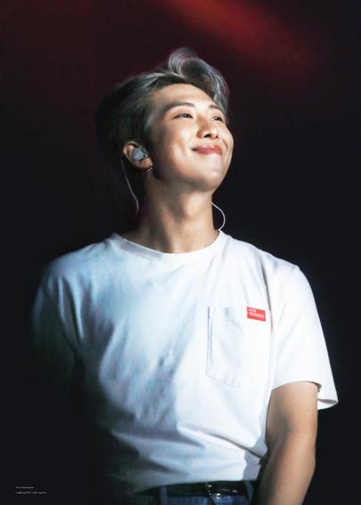 KNJ during love yourself tour, silver hair, beaming at the audience like he's proud of us