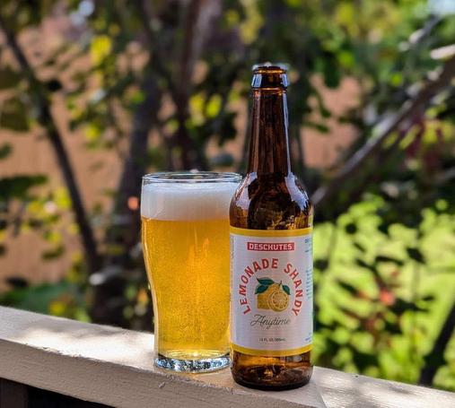 Anytime Lemonade Shandy from Deschutes Brewery. It seems like not many beers are released in bottles any more, but this one is (it's also in cans), and it's a nicely simple label with a lemon on it. The liquid inside is poured into a glass and it's a glowing yellow with ample carbonation.