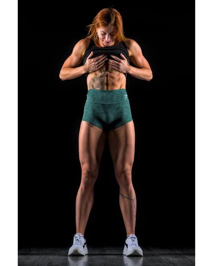bodybuilding woman shows her abs...