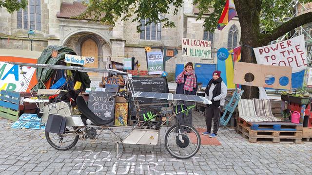 Solar bike parked next to climate camp Nördling