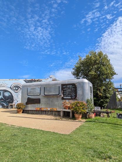 a renovated airstream van turned into a barista outlet
