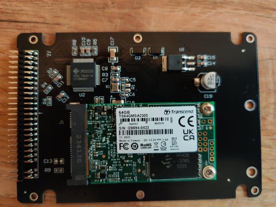 A close-up photo of a 64GB mSATA SSD mounted in an mSATA to 2.5 inch 44-pin IDE adapter. This device will replace the still-functioning spinning IDE disk in my vintage laptop.
