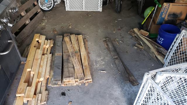 Piles of pulled apart pallets on my garage floor