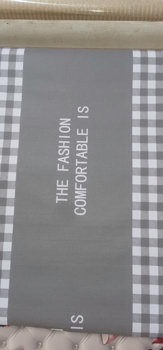 Plastic cover with the text " THE FASHION COMFORTABLE IS"