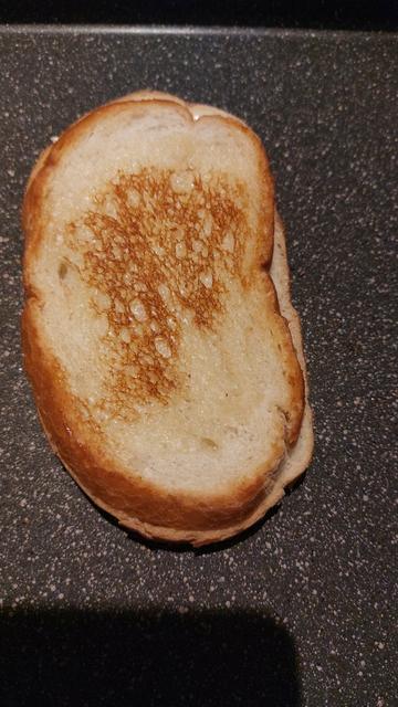 A grilled cheese sandwich in a frying pan