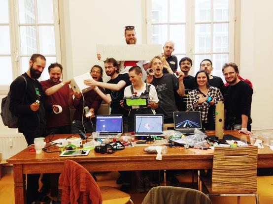 Group picture of the people who participated in the Burn the Keyboard workshop. Their creations can also be seen.
