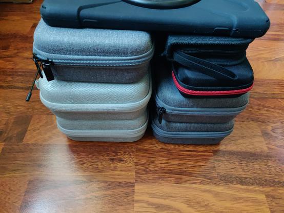 A tablet lies on small cases, side view.