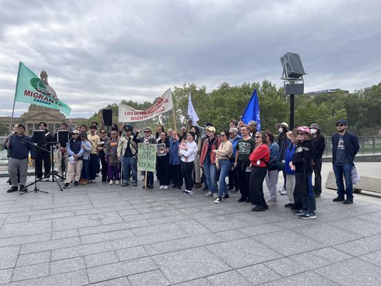 People at a migrant rights rally.