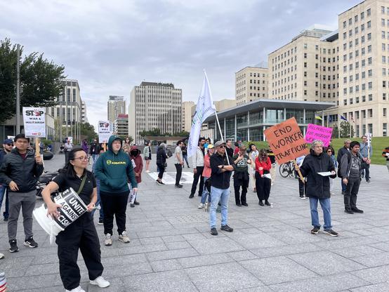 People at a migrant rights rally.