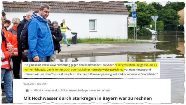 Eine Gruppe von Menschen steht am Rand einer überschwemmten Straße. Im Vordergrund trägt Markus Söder in blauer Regenjacke eine ernste Miene. Um ihn herum stehen weitere Personen, einige in orangefarbenen Einsatzjacken. Die Straße im Hintergrund ist teilweise von Wasser bedeckt. Ein weißes Gebäude mit braunem Ziegeldach sowie ein Straßenschild und mehrere grüne Büsche sind sichtbar. Die Szenerie deutet auf die Folgen eines Hochwassers hin.