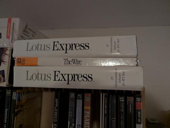 A picture showings two copies of lotus express (a 1987 DOS mail client) and one copy of The Wire (a 1991 windows 3 mail client).

Both of the mail clients are for MCI mail, a now-defunct pre-internet electronic mail service.