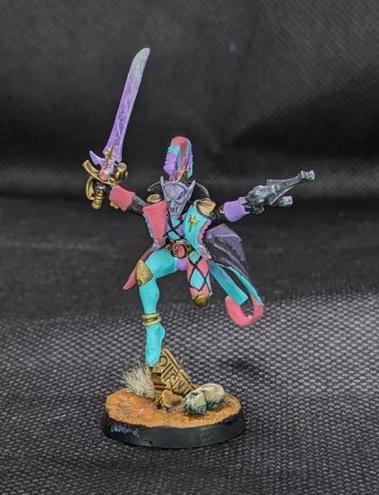 A harlequin with a power sword