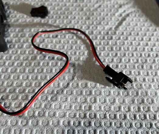 Both pins on the end of the red and black wires inserted into the black male JST SM connector.