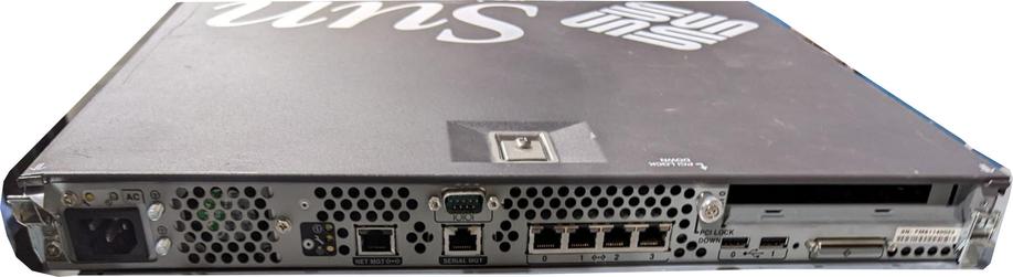 The back of a 1U Sun Microsystems rack mount server, showing the various connectors (multiple Ethernet ports, management ports, SCSI, USB, etc)