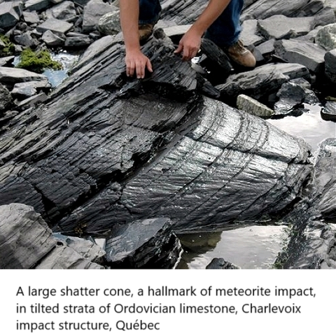 photo - A large shatter cone, a hallmark of meteorite impact, in tilted strata of Ordovician limestone, Charlevoix impact structure, Québec