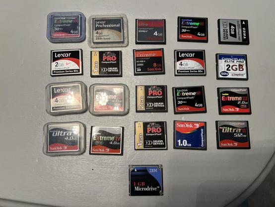 Twenty-one small-capacity Compact Flash cards, ranging in size from 512MB to 8GB.