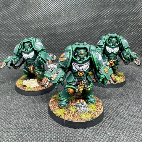 A Squad of Dark Angels Aggressors armed with Flamestorm Gauntlets