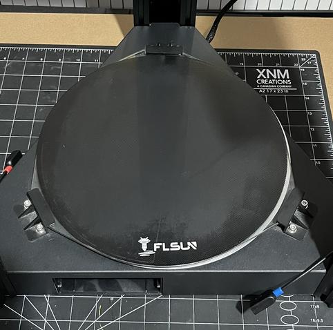 The stock glass bed of the FLSun Super Racer 3D printer, installed in the printer