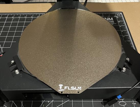 The FLSun magnetic removable spring steel PEI plate attached to the magnetic bed in the FLSun Super Racer 3D printer.