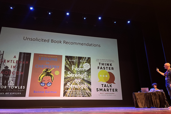 unsolicited book recommendations' by Alon Halevy.
- Amor Towles: A Gentleman in Moscow, 
- Bonnie Garmus: Lessons in Chemistry, 
- A. Brooks: From Strength to Strength, 
- M. Abrahams: Think Faster, Talk Smarter
Alon standing next to the closing slide of his keynote talk