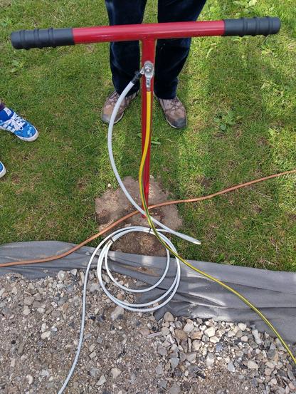 Ground rod solution with an manual auger drill, for a temporary telecom cell towers at a music festival