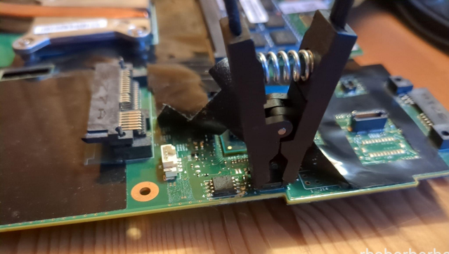image of a programmer clip stuck onto the "top" BIOS chip on a Thinkpad T430 mobo