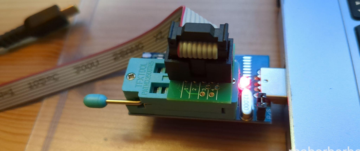 image of a programmer clip stuck onto the "top" BIOS chip on a Thinkpad T430 mobo