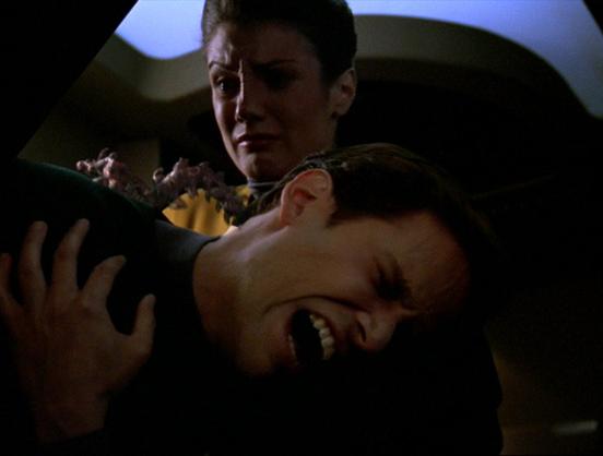 An alien slug crawls out of a crewman's neck, and this is NOT Wrath of Khan.