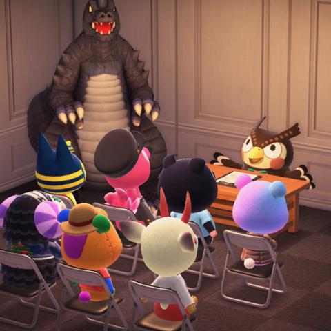 Animal Crossing: New Horizons screenshot. The screenshot is set in a white, paneled wall room. A crowd of villagers are sitting in folding chairs facing, from left to right are a kaiju statue, Blathers behind a light brown desk with papers on it, and a projector screen. It looks like Blathers is giving a talk about something.