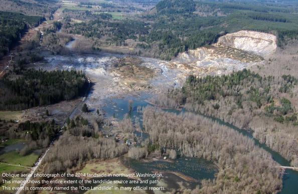 Oblique aerial photograph of the 2014 landslide in northwest Washington. This image shows the entire extent of the landslide source area and path. This event is commonly named the “Oso Landslide” in many official reports.