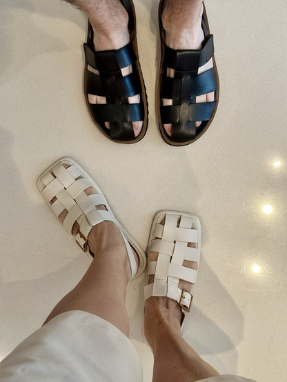 Foto of sandals - one in black @ one in cream.