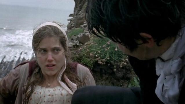 A woman looks up at a man, charmed by the way he rushed to her rescue
