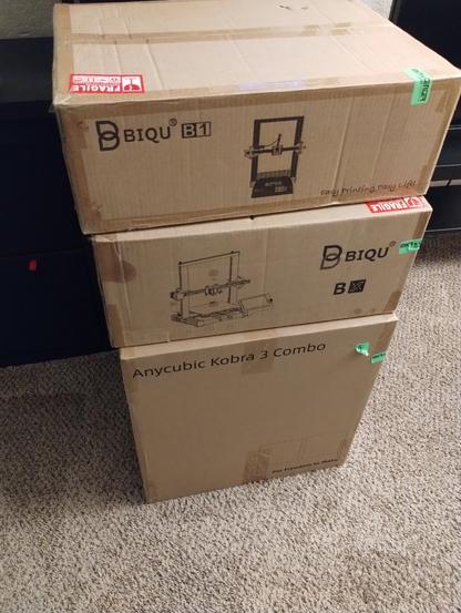 3 - 3D printers
On top a Biqu B1, next a Biqu BX
and finally the printer I really wanted
The Anycubi Kobra 3 Combo 
All brand new, sitting in the boxes waiting to be put together.