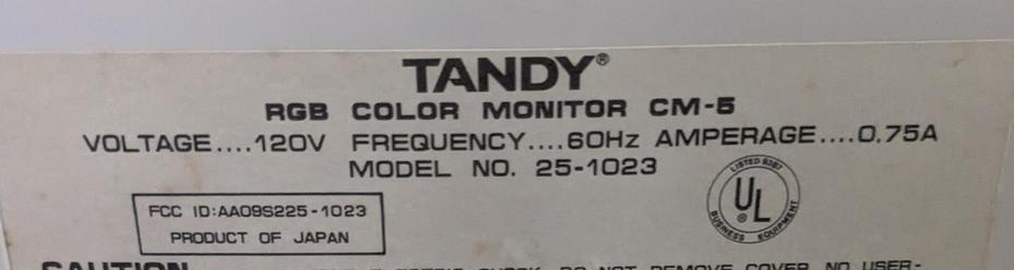A sticker at the back of a monitor with the following text on it "Tandy RGB COLOR MONITOR CM-5
VOLTAGE 120V FREQUENCY 60Hz AMPERAGE 0.75A
MODEL NO. 25-1023"