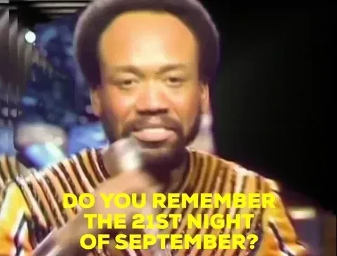 A man dancing and singing into a microphone. The caption reads, "Do you remember the 21st night of September?"
