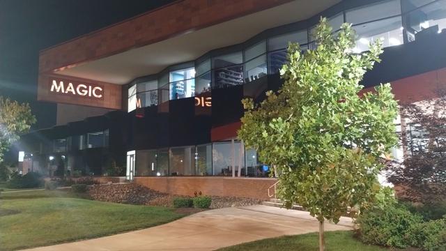 RIT's Magic Center.  In the upper left corner is the word MAGIC etched into the building and lit up.