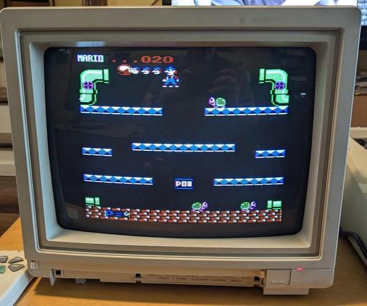 Mario's Bros game on an old color CRT monitor.