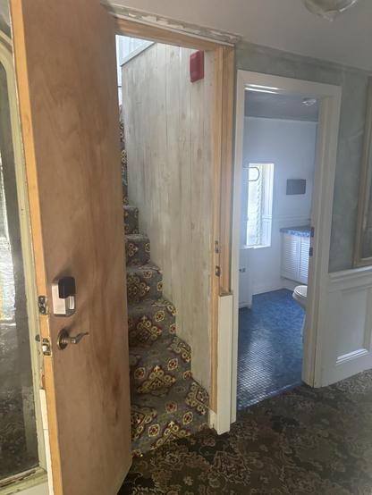 The painting/ hidden door to our tiny staircase hidden hotel room