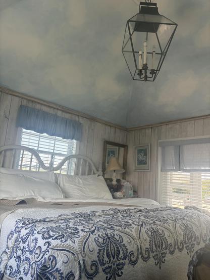 Once you climbed the hidden stairs, you get to a small sunny room with they sky painted on the vaulted ceiling.
